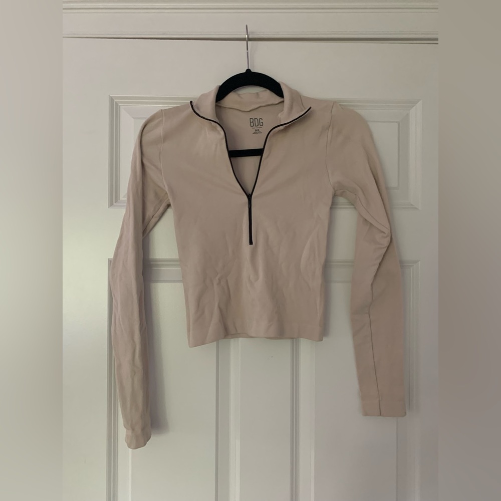 BDG light tan and black quarter zip top.